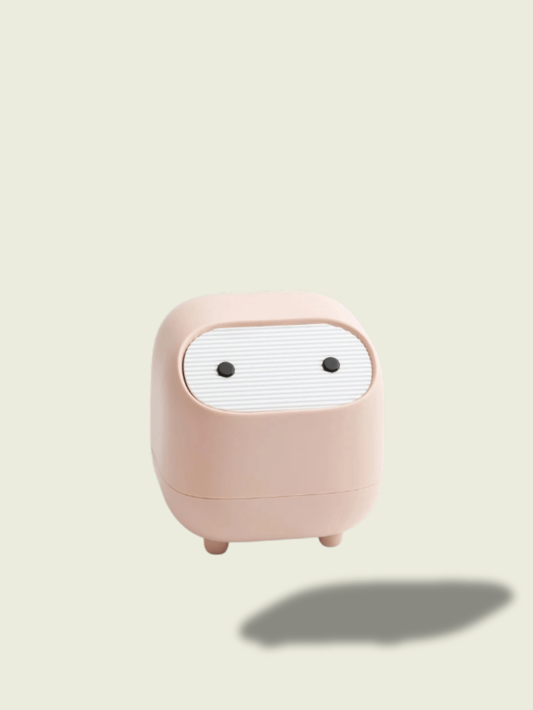 Mini poubelle de bureau Nobi rose dans une salle de bain